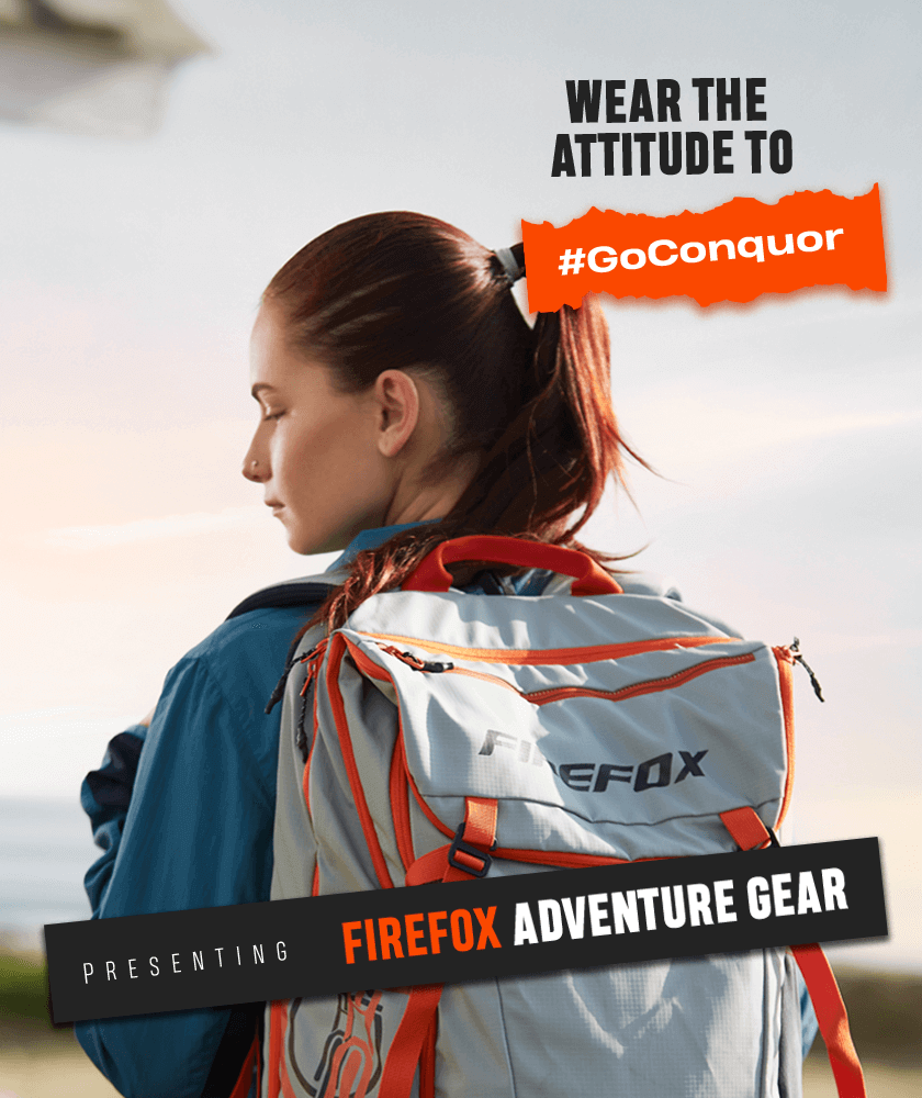 Woman wearing a grey and orange Firefox backpack